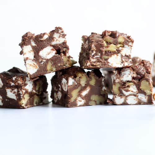 Delicious Rocky Road Fudge is filled with chocolate, walnuts, and marshmallows. Easy to make in the microwave or on the stove. VIDEO