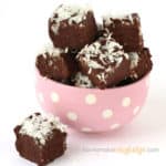 pink and white polka dot candy dish filled with chocolate coconut fudge