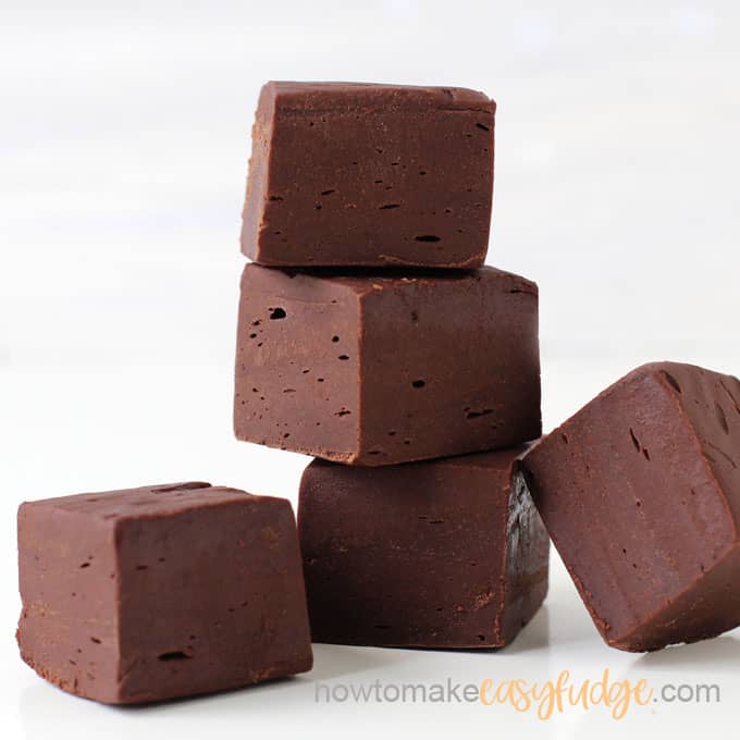 chocolate fudge stacked up sitting on a white background