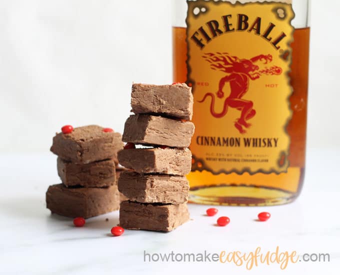 Fireball fudge stacked in front of whiskey bottle 