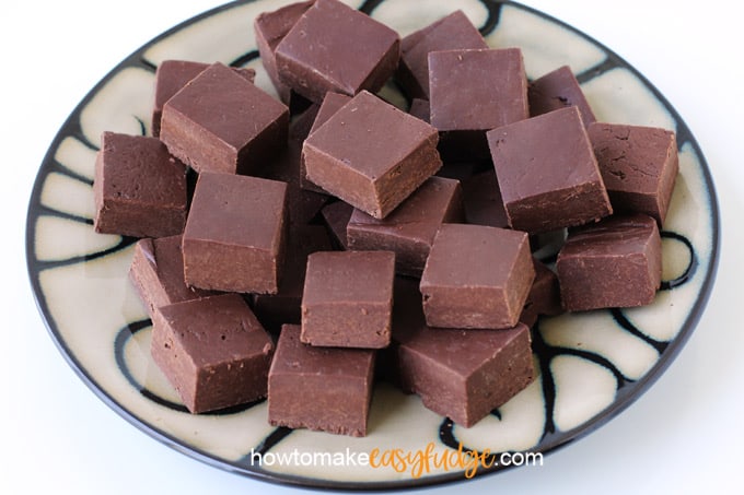 small pieces of milk chocolate fudge on a round dinner plate