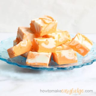 easy orange creamsicle fudge on a blue plate