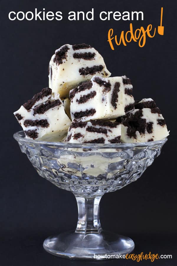 Cookies and cream fudge,a combination of white chocolate fudge with OREO Cookies, in a glass candy dish on a black background
