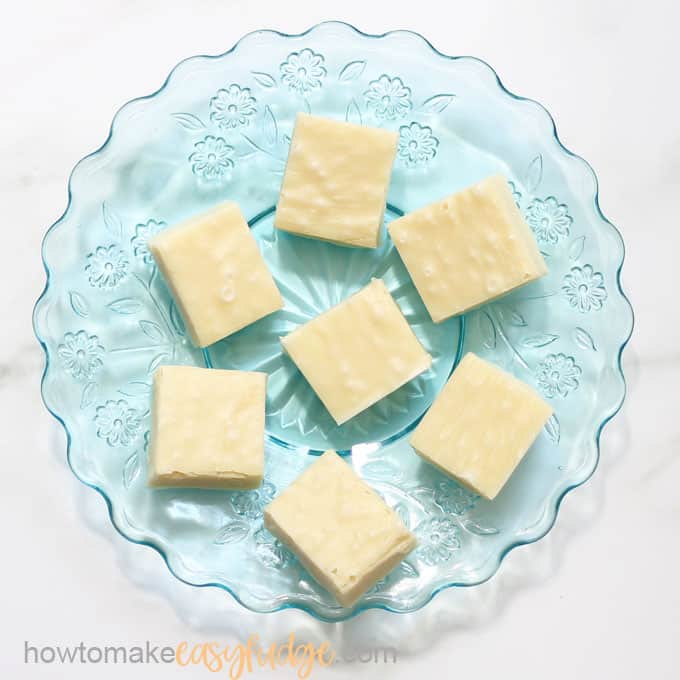 overhead image of white vanilla fudge on blue plate