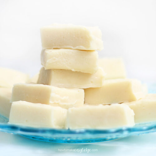 easy vanilla fudge recipe stacked on blue plate