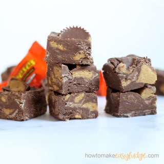 REESE'S FUDGE: Reese's peanut butter cups stirred into delicious, easy fudge. This 3-ingredient fudge uses leftover Halloween candy. Freeze fudge for the holidays! #reeses #reesespeanutbuttercups #candybars #chocolate #halloween #leftoverHalloween #easyfudge #fudgerecipe #nobakedessert