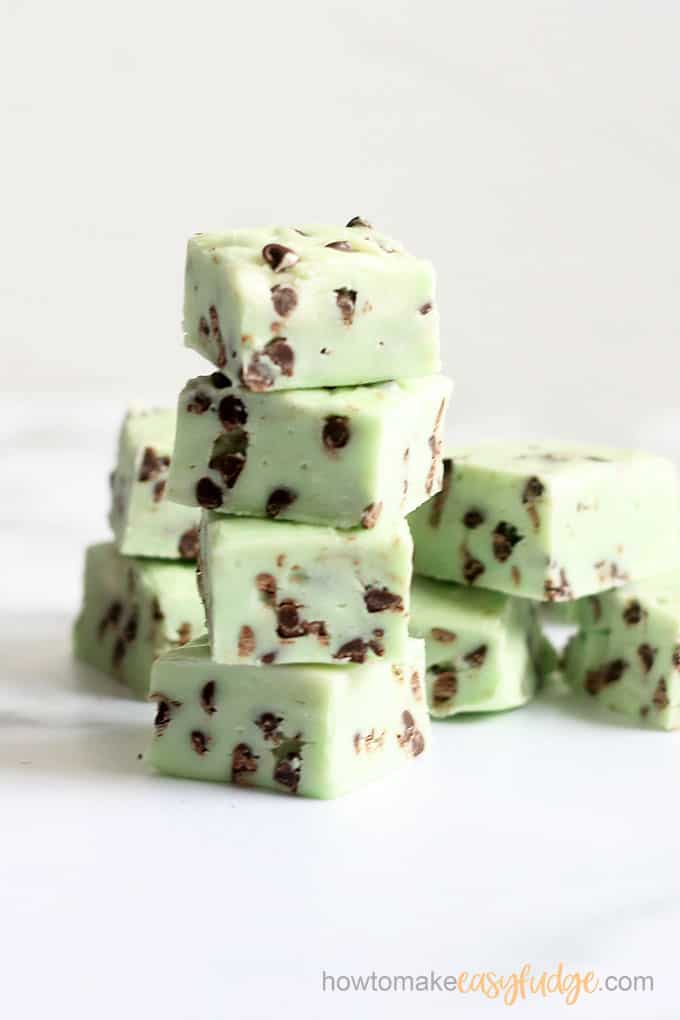 vertical image of stacked mint chocolate chip fudge 