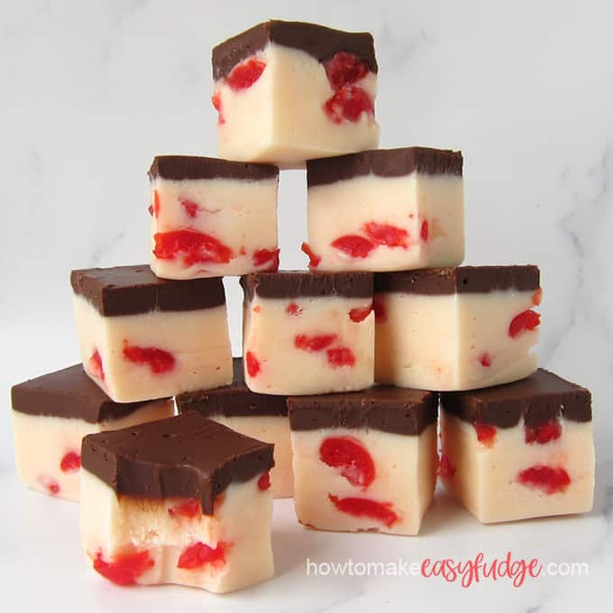 squares of cherry coke fudge stacked on top of each other in a pyramid shape