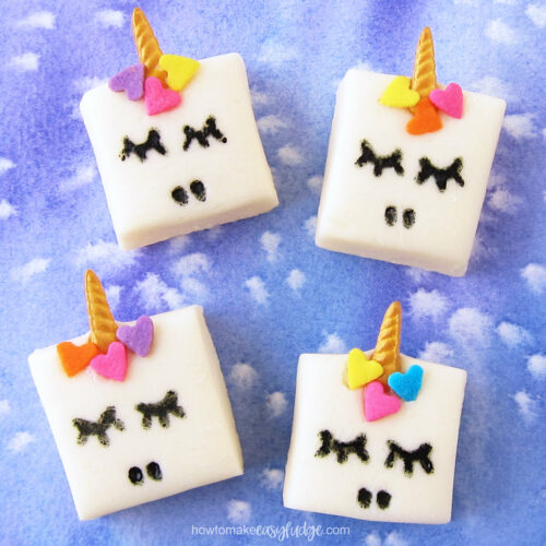 unicorn fudge with gold candy horns and brightly colored heart sprinkle manes