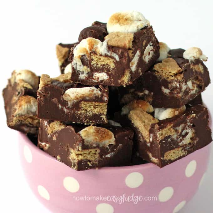 Closeup of yummy s'mores fudge piled high in a pink and white polka dotted bowl. 