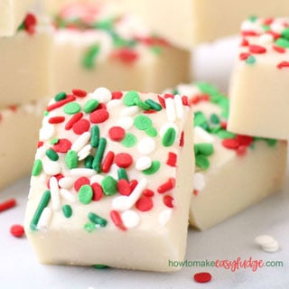 Christmas fudge flavored with almond extract and decorated with red, white, and green sprinkles.