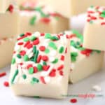 Top a 4-ingredient white chocolate fudge with Christmas sprinkles. The red, white and green sprinkles make this easy Christmas Fudge look really festive.