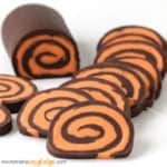 Layers of chocolate and orange fudge are swirled together to create pinwheels.