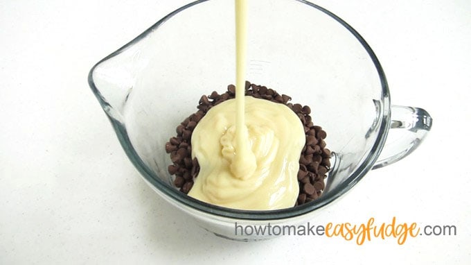 pour sweetened condensed milk over milk chocolate chips