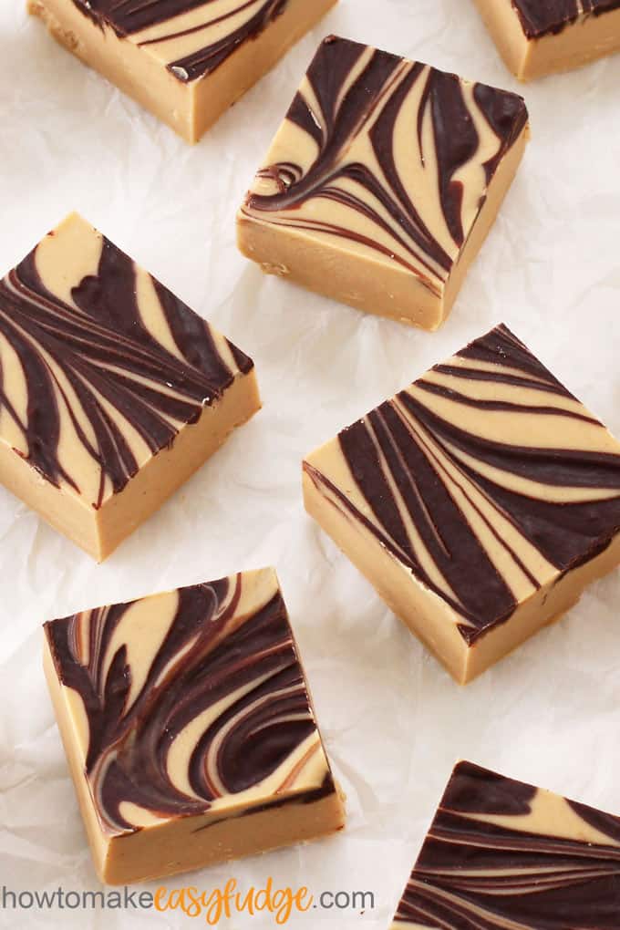 Tiger butter fudge is peanut butter fudge with stripes of chocolate ganache.