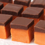 Butterfinger fudge with a layer of candy corn fudge and chocolate fudge