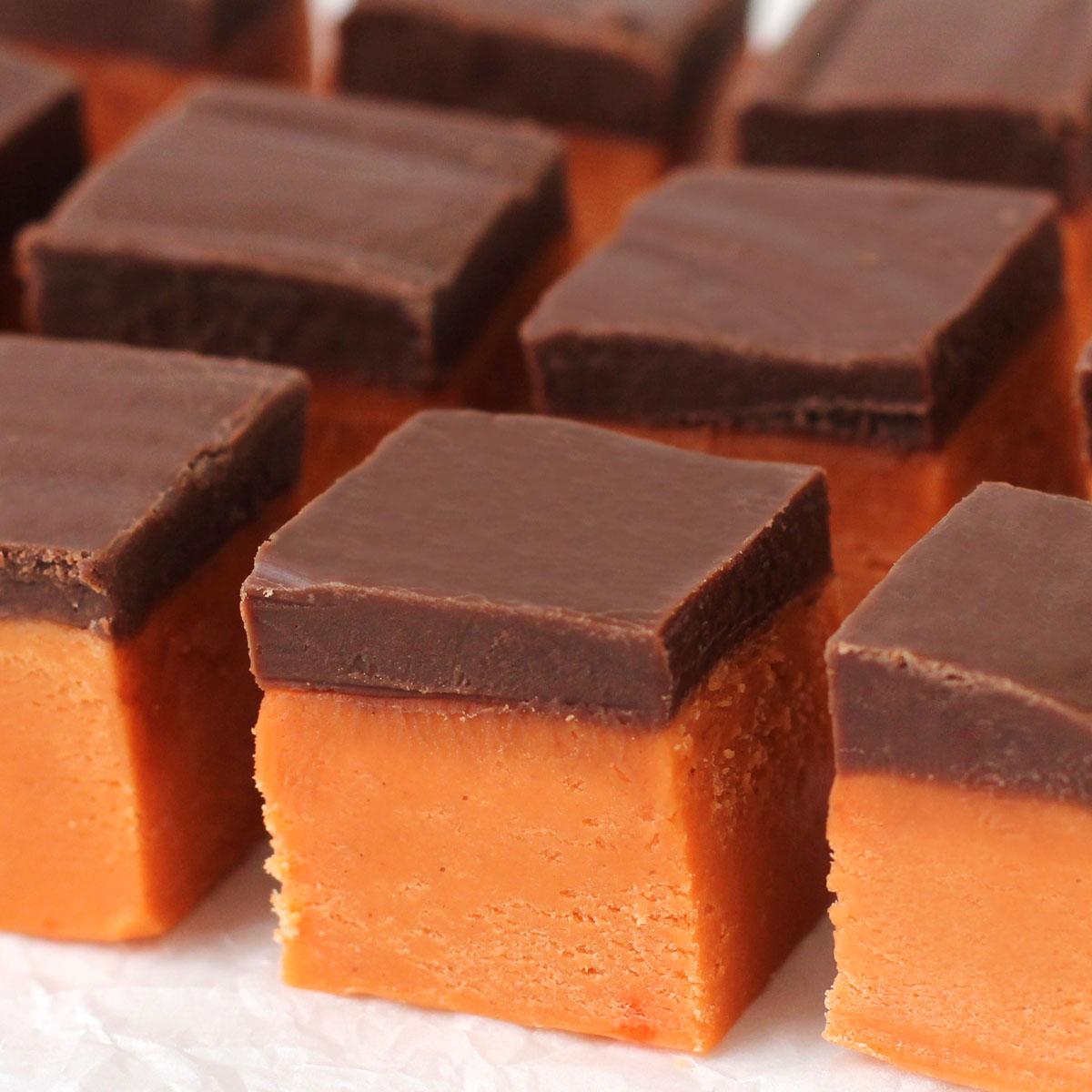 Butterfinger fudge with a layer of candy corn fudge and chocolate fudge