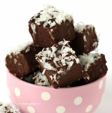 chocolate coconut fudge piled up in a pink polka dot bowl