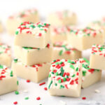 White chocolate Christmas fudge topped with red, white, and green sprinkles