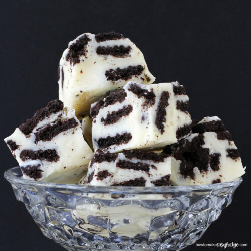 Cookies and cream OREO fudge stacked in a clear glass candy dish