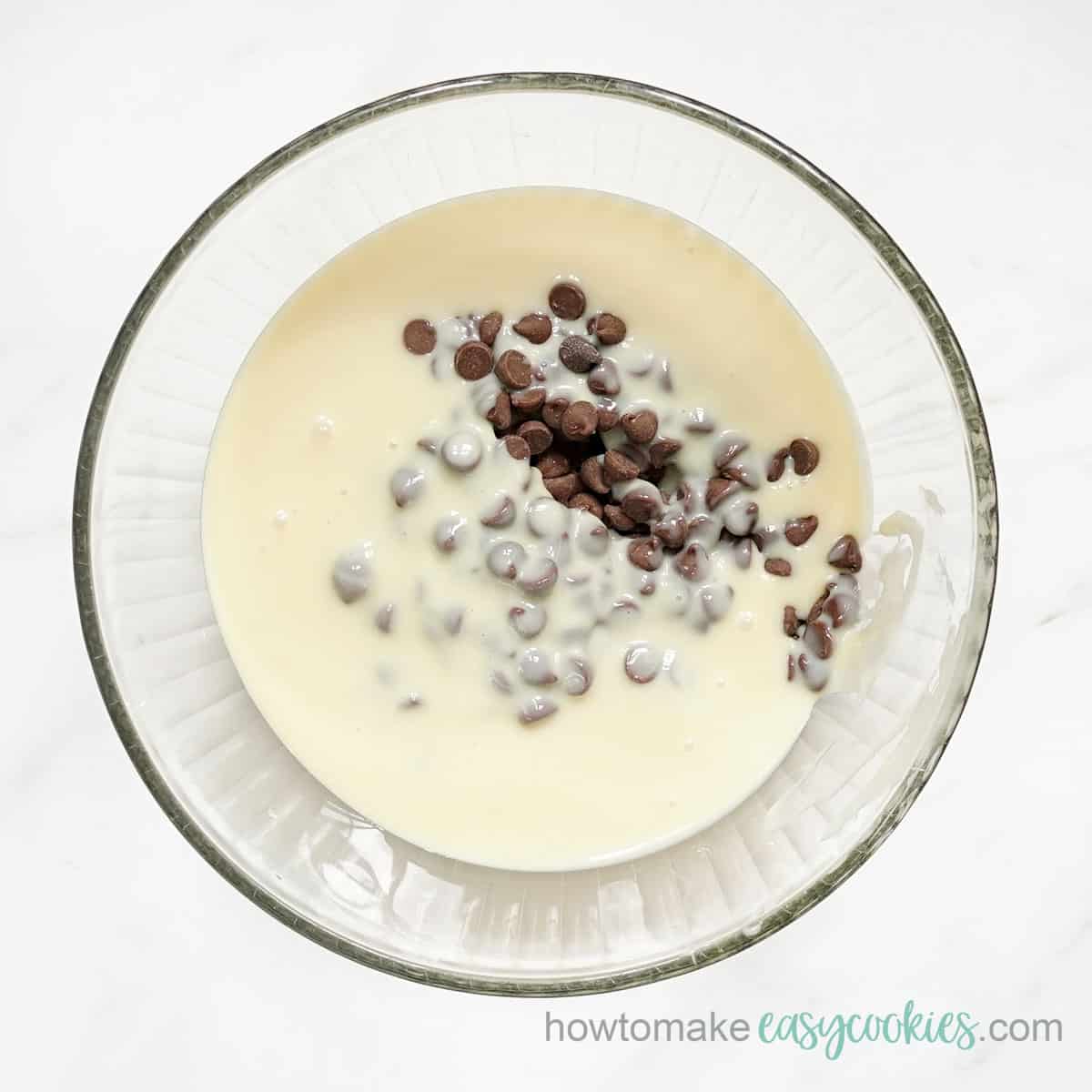 Bowl with sweetened condensed milk and chocolate chips