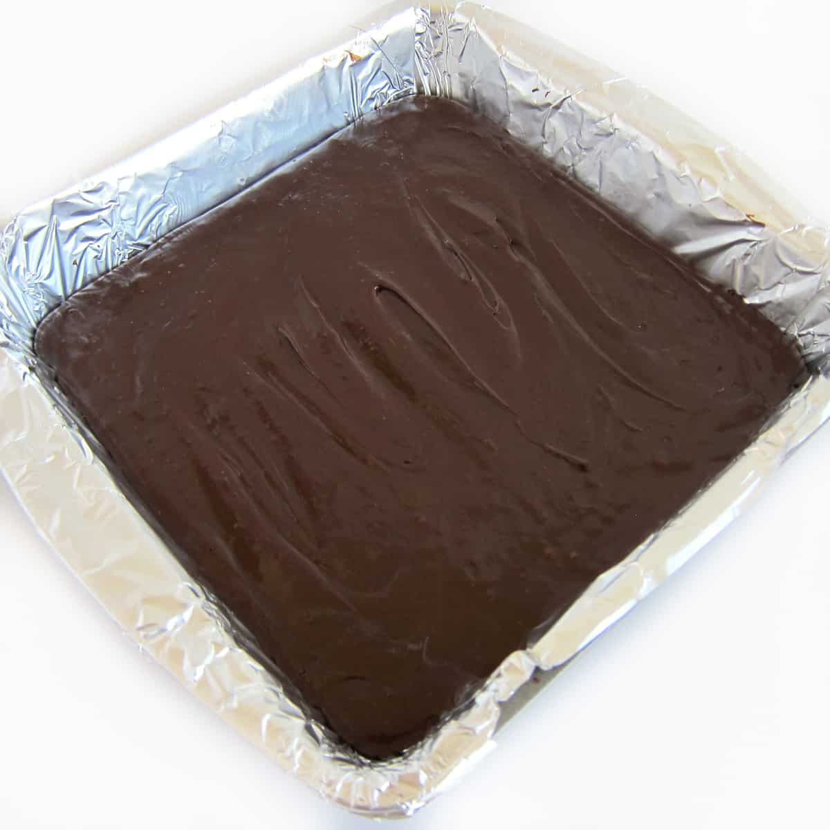 8-inch square pan filled with chocolate Amaretto fudge