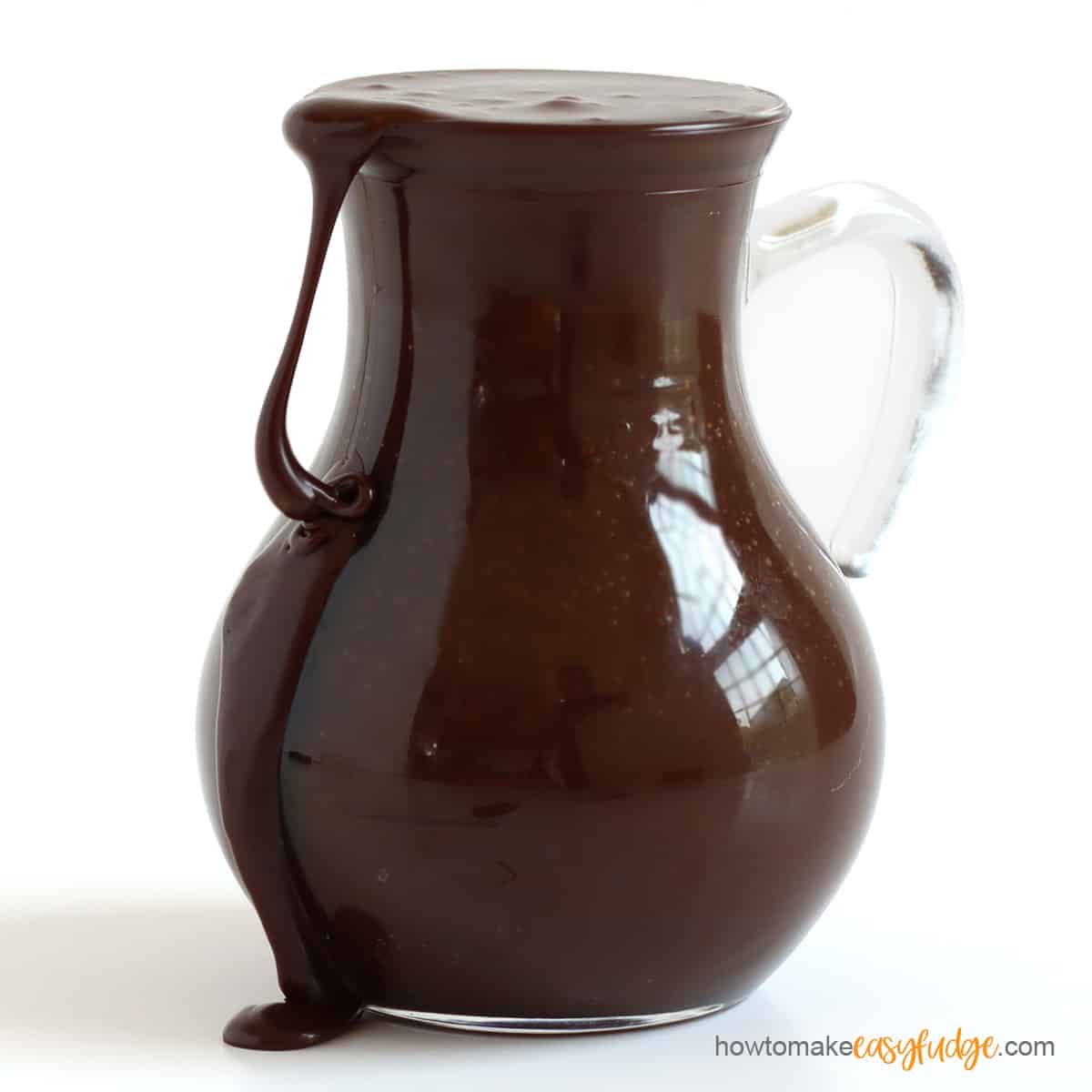 4-ingredient hot fudge sauce in a glass pitcher