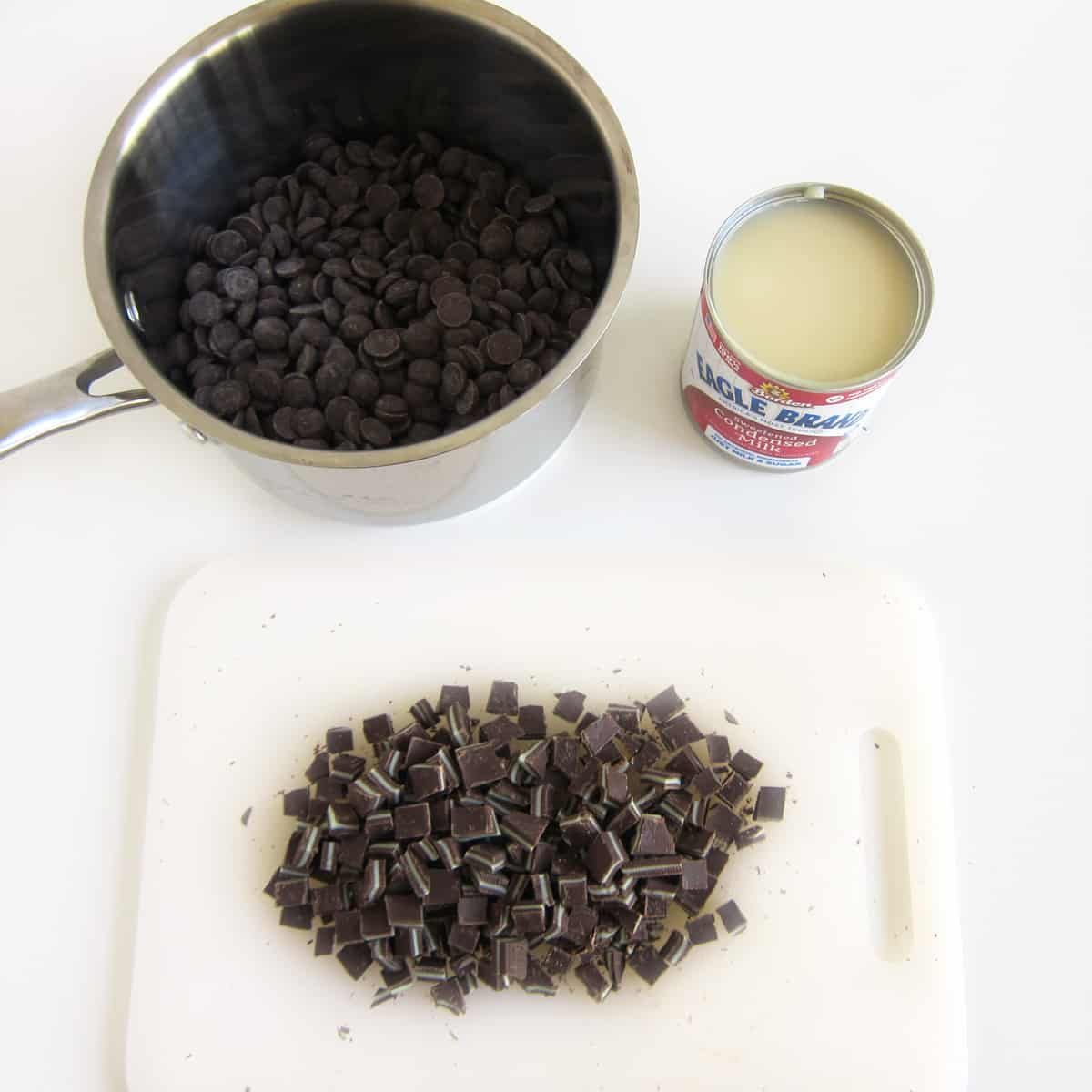 saucepan of chocolate chips, can of sweetened condensed milk, and chopped Andes Mints