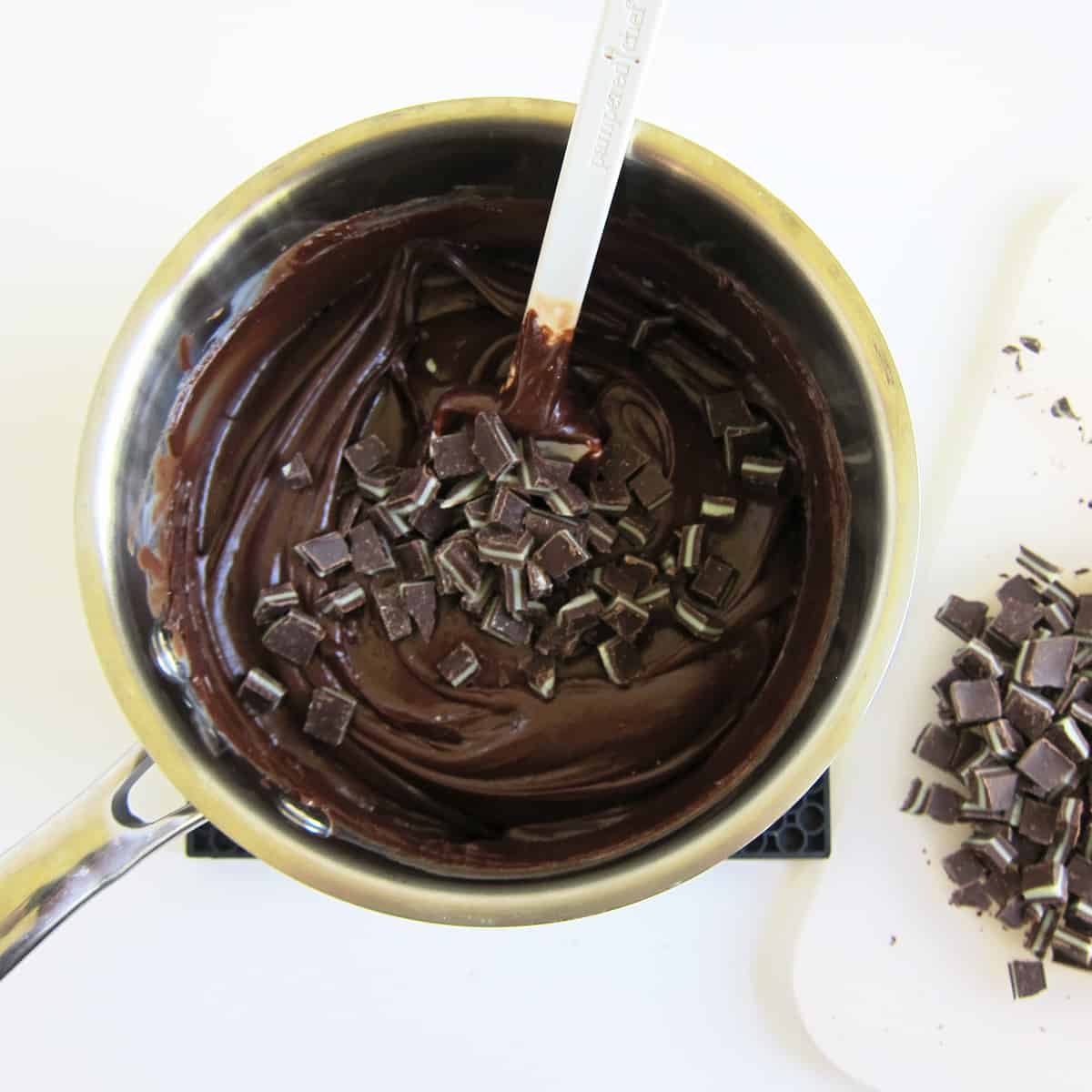 melted chocolate fudge with chopped Andes Mints on top.