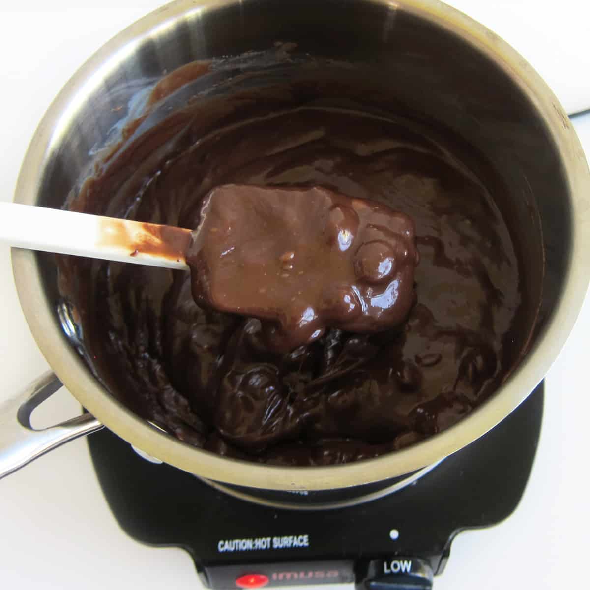 chocolate and sweetened condensed milk melting over low heat