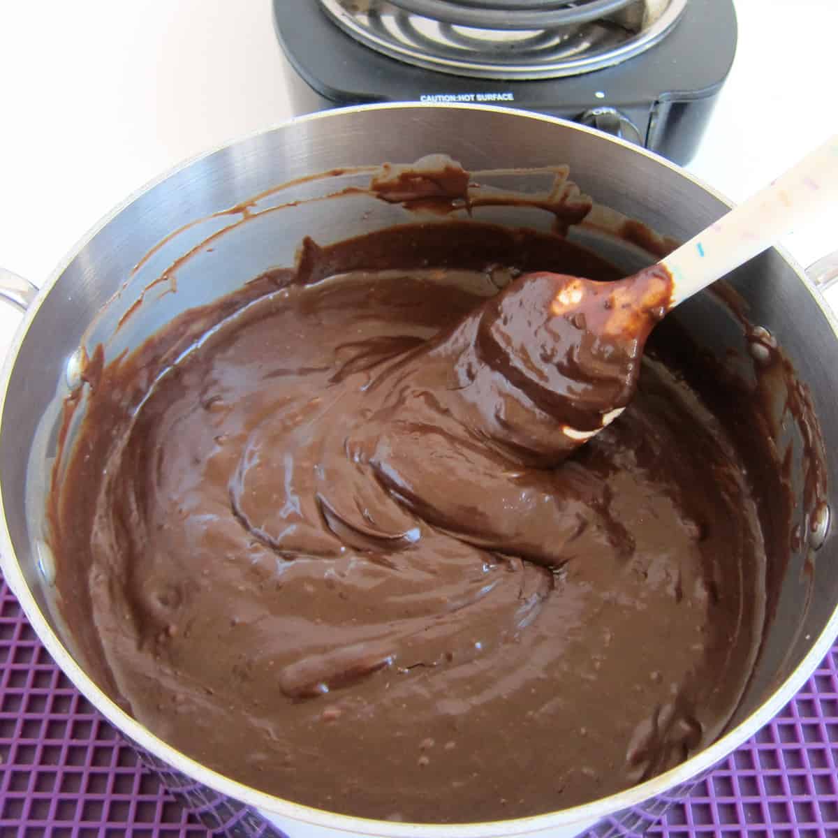 stirring hot chocolate fudge in the saucepan until smooth.